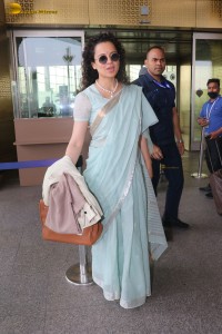 Indian actress kangana ranaut in a light blue saree at mumbai airport