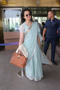 Indian actress kangana ranaut in a light blue saree at mumbai airport
