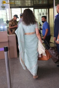 Indian actress kangana ranaut in a light blue saree at mumbai airport