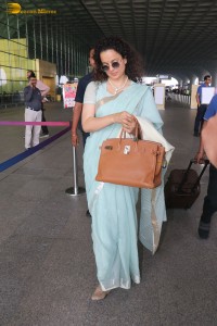 Indian actress kangana ranaut in a light blue saree at mumbai airport