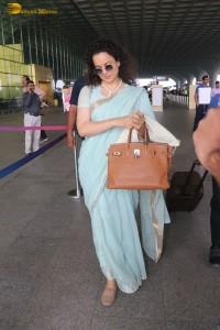 Indian actress kangana ranaut in a light blue saree at mumbai airport