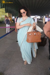 Indian actress kangana ranaut in a light blue saree at mumbai airport