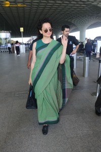 actress kangana ranaut in a green saree at airport