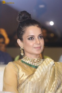 actress Kangana Ranaut shines in a gold saree at a function