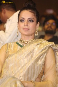actress Kangana Ranaut shines in a gold saree at a function