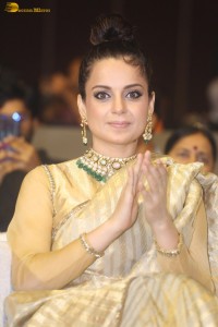 actress Kangana Ranaut shines in a gold saree at a function