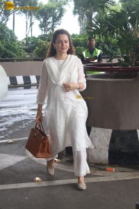 actress and Lok Sabha MP Kangana Ranaut in a white salwar dress at mumbai airport