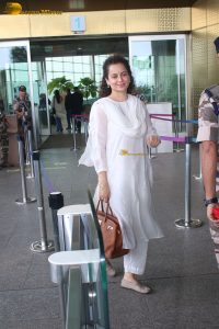 actress and Lok Sabha MP Kangana Ranaut in a white salwar dress at mumbai airport