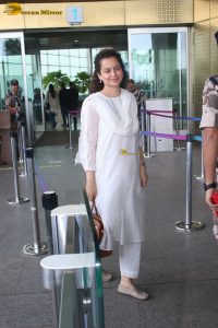 actress and Lok Sabha MP Kangana Ranaut in a white salwar dress at mumbai airport