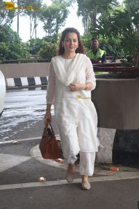 actress and Lok Sabha MP Kangana Ranaut in a white salwar dress at mumbai airport