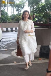 actress and Lok Sabha MP Kangana Ranaut in a white salwar dress at mumbai airport