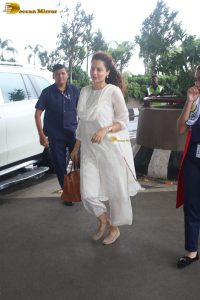 actress and Lok Sabha MP Kangana Ranaut in a white salwar dress at mumbai airport
