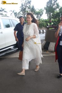 actress and Lok Sabha MP Kangana Ranaut in a white salwar dress at mumbai airport