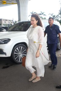 actress and Lok Sabha MP Kangana Ranaut in a white salwar dress at mumbai airport