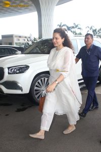 actress and Lok Sabha MP Kangana Ranaut in a white salwar dress at mumbai airport