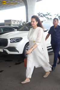 actress and Lok Sabha MP Kangana Ranaut in a white salwar dress at mumbai airport