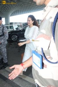 actress and Lok Sabha MP Kangana Ranaut in a white salwar dress at mumbai airport