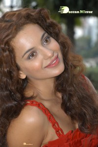 Kangana Ranaut in a short red dress attending a movie function