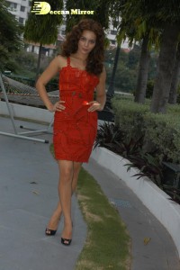 Kangana Ranaut in a short red dress attending a movie function