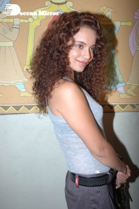 Actress Kangana Ranaut dressed in a grey top and black trousers