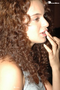 Actress Kangana Ranaut dressed in a grey top and black trousers