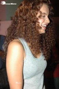 Actress Kangana Ranaut dressed in a grey top and black trousers