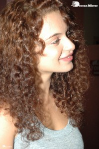 Actress Kangana Ranaut dressed in a grey top and black trousers