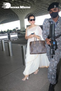 Kangana Ranaut in a white saree at the airport