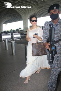 Kangana Ranaut in a white saree at the airport