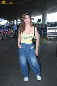 actress Kangna Sharma pretty in a yellow tank top at mumbai airport