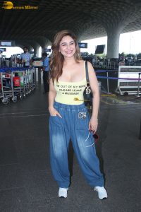 actress Kangna Sharma pretty in a yellow tank top at mumbai airport