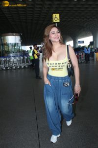 actress Kangna Sharma pretty in a yellow tank top at mumbai airport