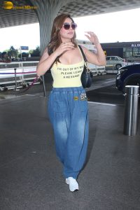 actress Kangna Sharma pretty in a yellow tank top at mumbai airport