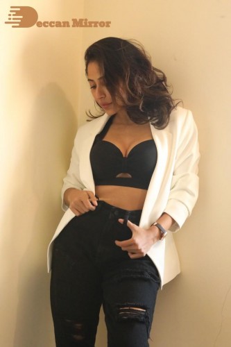 Bollywood and Telugu Cinema Actress Kapilakshi Malhotra posing for a hot photoshoot in black and white dress