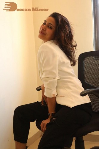 Bollywood and Telugu Cinema Actress Kapilakshi Malhotra posing for a hot photoshoot in black and white dress