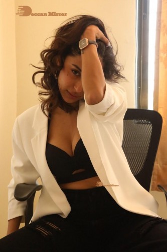 Bollywood and Telugu Cinema Actress Kapilakshi Malhotra posing for a hot photoshoot in black and white dress