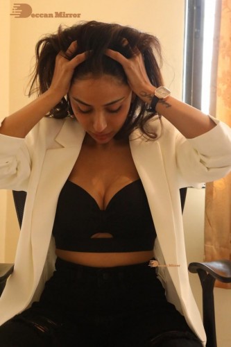 Bollywood and Telugu Cinema Actress Kapilakshi Malhotra posing for a hot photoshoot in black and white dress