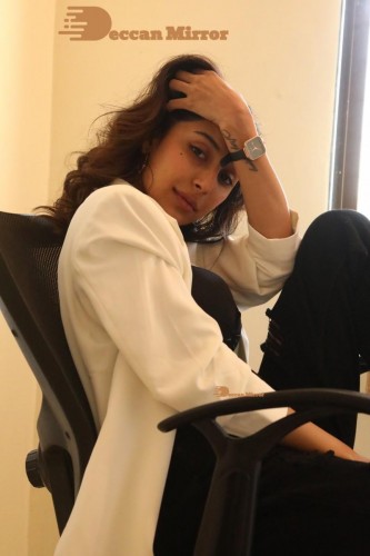 Bollywood and Telugu Cinema Actress Kapilakshi Malhotra posing for a hot photoshoot in black and white dress