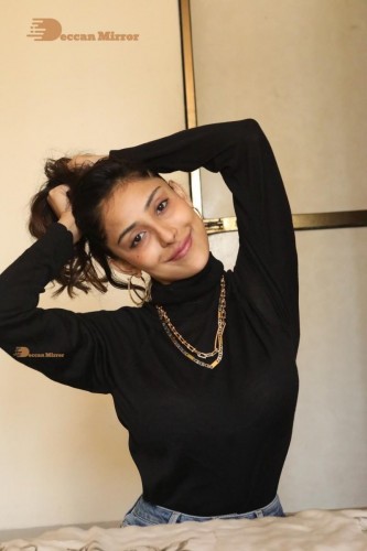 Bollywood and Telugu Cinema Actress Kapilakshi Malhotra poses for pictures in black top and blue jeans