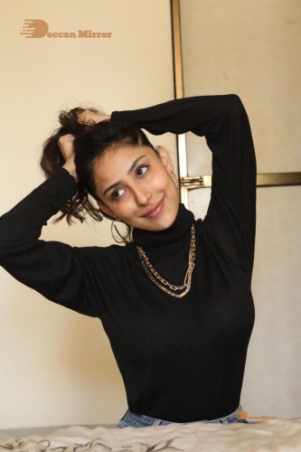 Bollywood and Telugu Cinema Actress Kapilakshi Malhotra poses for pictures in black top and blue jeans