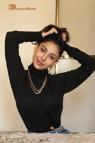 Bollywood and Telugu Cinema Actress Kapilakshi Malhotra poses for pictures in black top and blue jeans