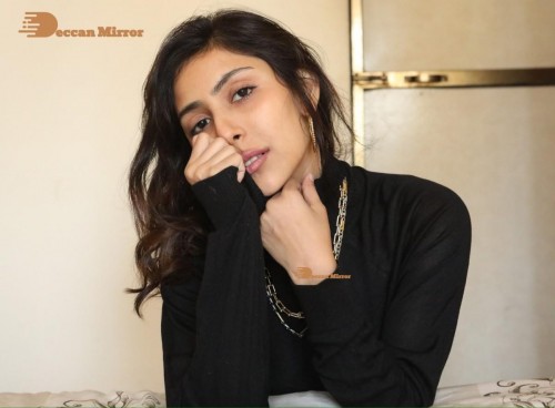 Bollywood and Telugu Cinema Actress Kapilakshi Malhotra poses for pictures in black top and blue jeans