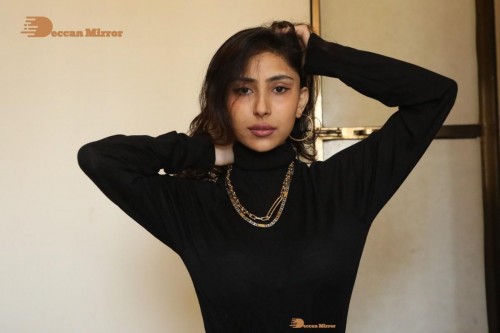 Bollywood and Telugu Cinema Actress Kapilakshi Malhotra poses for pictures in black top and blue jeans