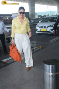 actress Kareena Kapoor stylish in a yellow shirt at mumbai airport