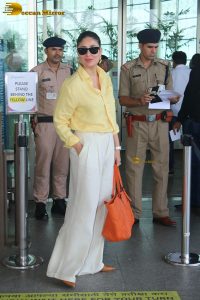 actress Kareena Kapoor stylish in a yellow shirt at mumbai airport