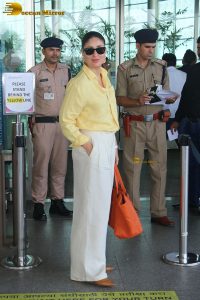actress Kareena Kapoor stylish in a yellow shirt at mumbai airport