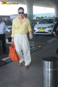 actress Kareena Kapoor stylish in a yellow shirt at mumbai airport