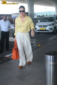 actress Kareena Kapoor stylish in a yellow shirt at mumbai airport