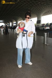 actress karishma tanna with her cute dog at airport