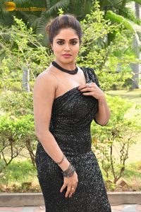 actress Karunya Chowdary sexy photo shoot in a black dress